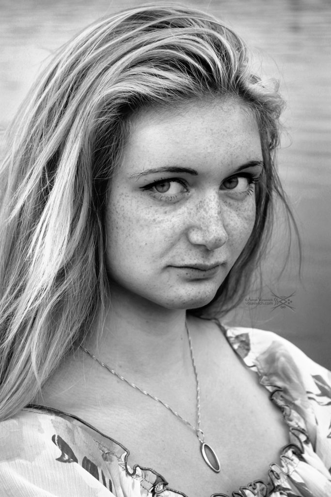 Black and white portrait of girl with freckles